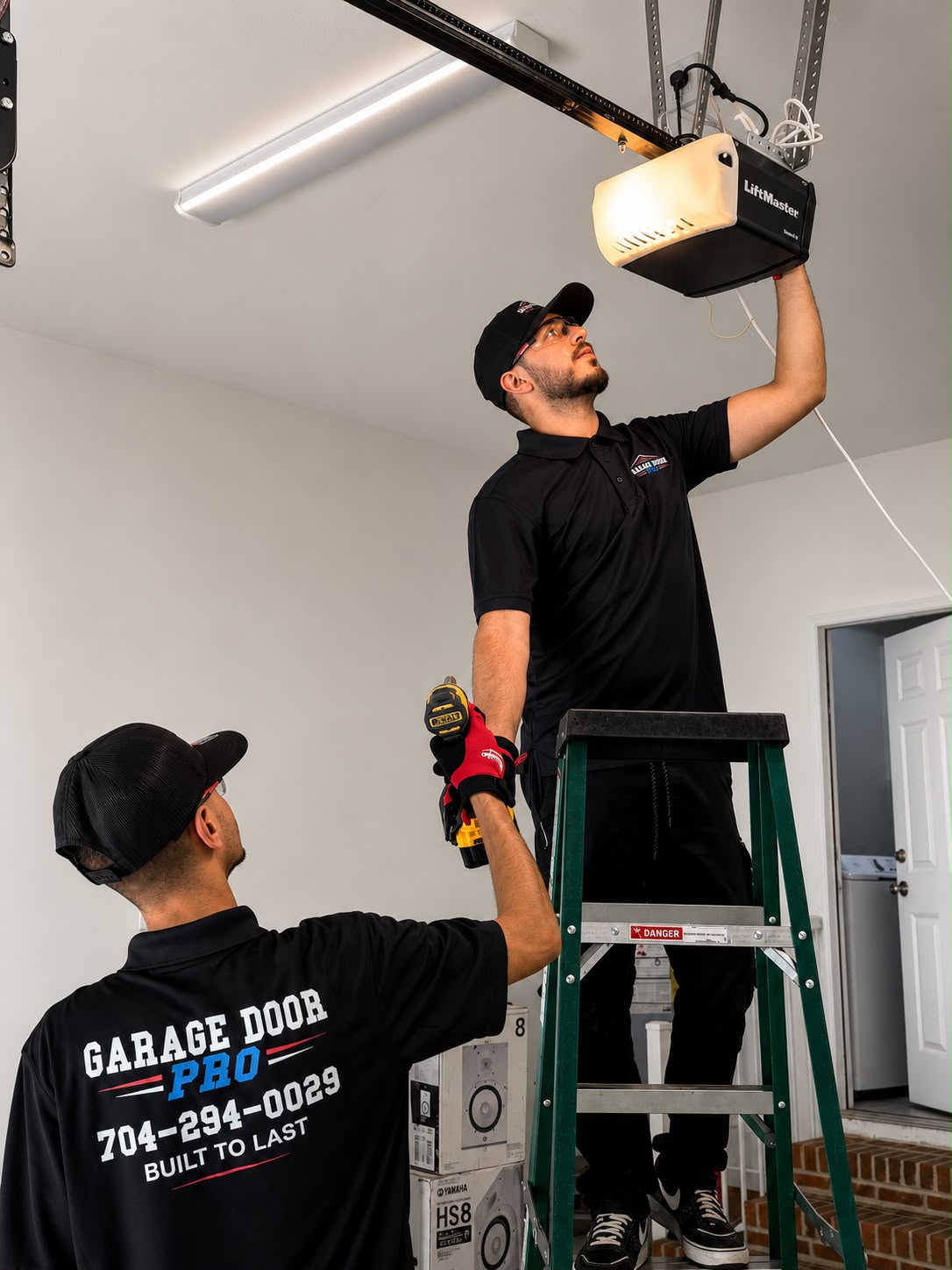 Garage Door Pro technicians installing LiftMaster garage door opener - professional opener installation Charlotte NC