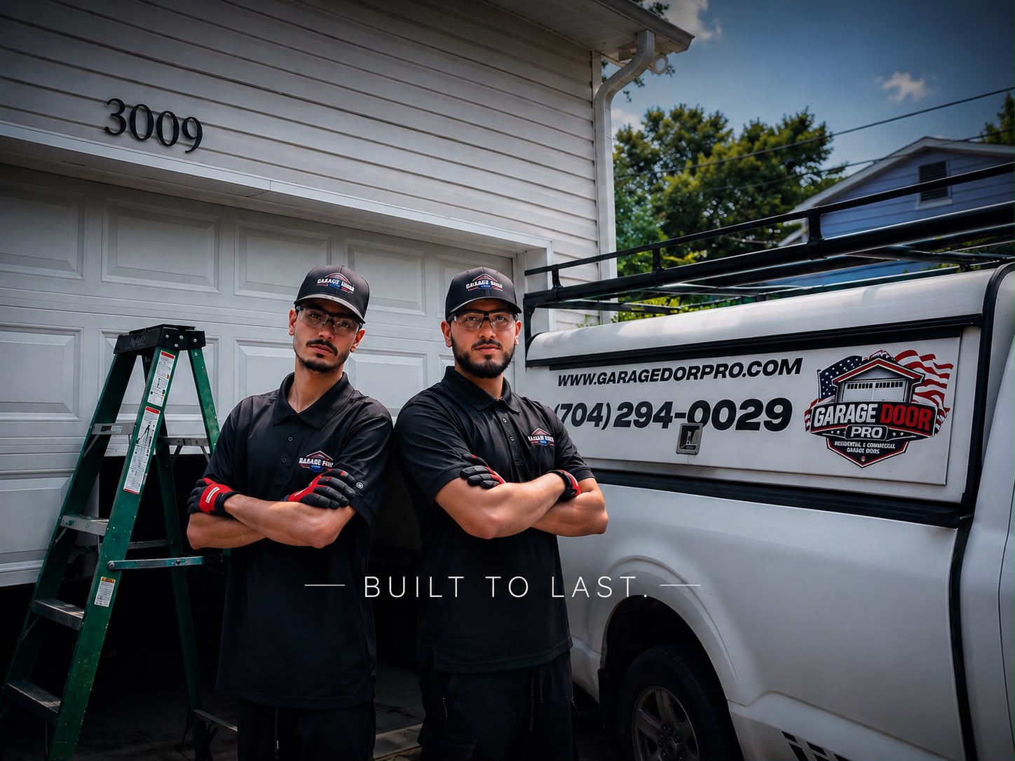 Garage Door Pro technicians standing in front of branded service truck at residential garage - Charlotte NC 704-294-0029